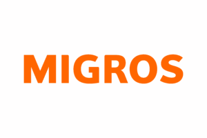 Logo de Migros – enseigne suisse collaborant avec l’agence pour des événements publics et commerciaux